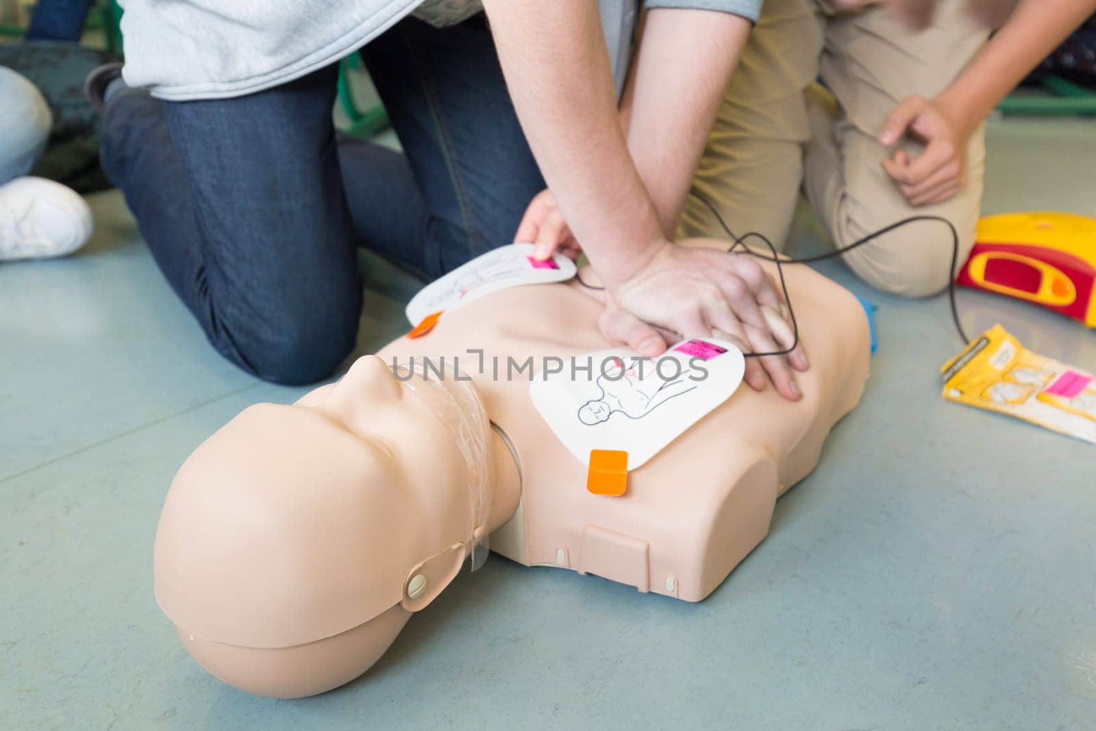 First aid cardiopulmonary resuscitation course using automated external defibrillator device, AED.