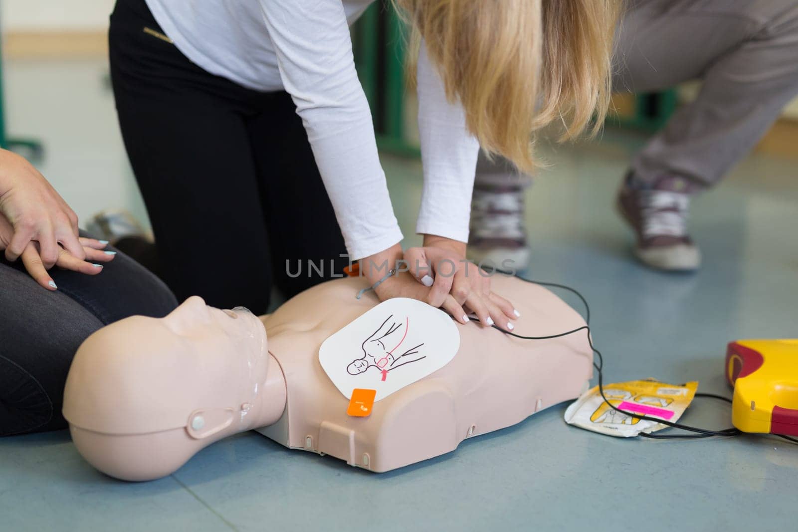 First aid cardiopulmonary resuscitation course using automated external defibrillator device, AED.