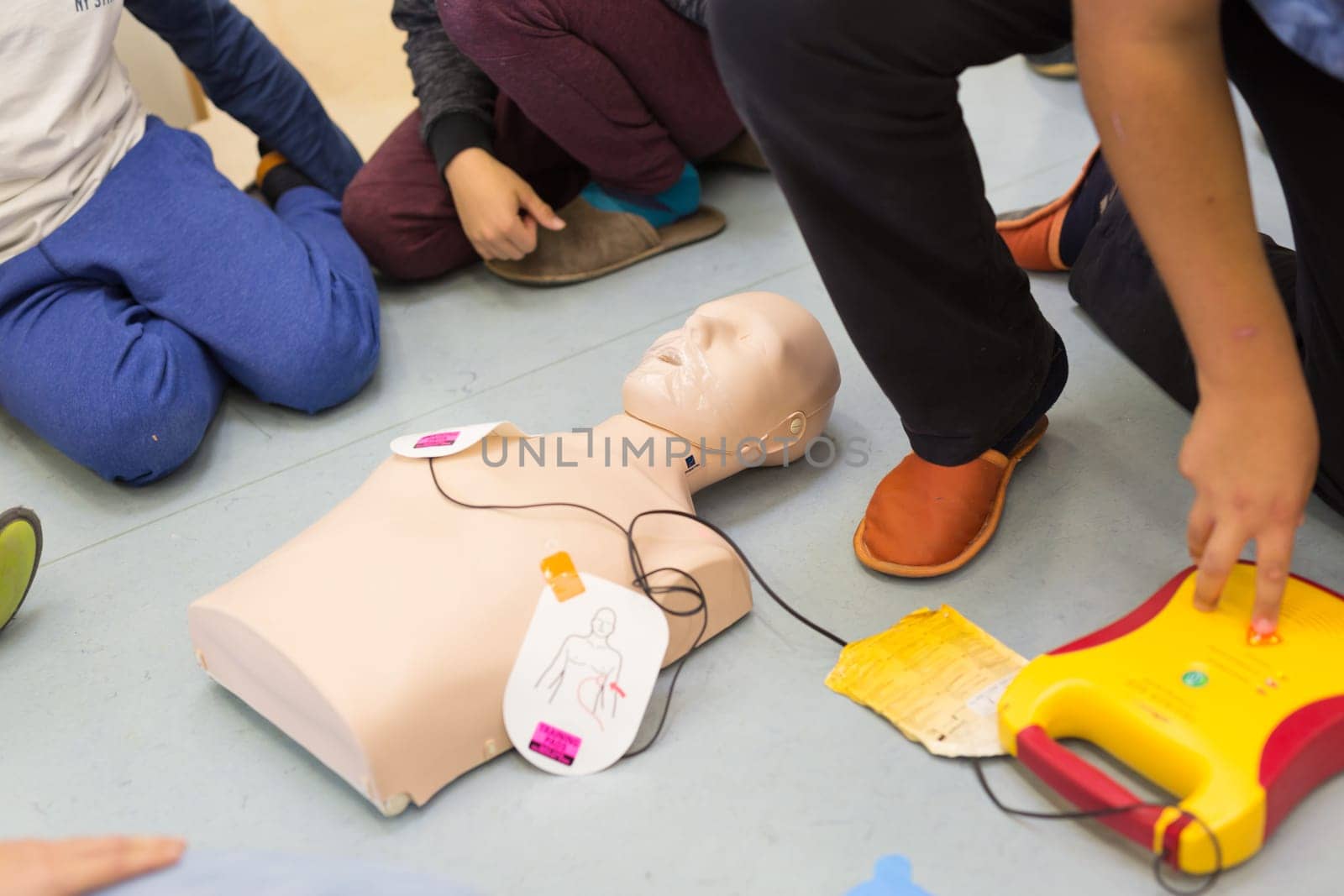 First aid cardiopulmonary resuscitation course using automated external defibrillator device, AED.