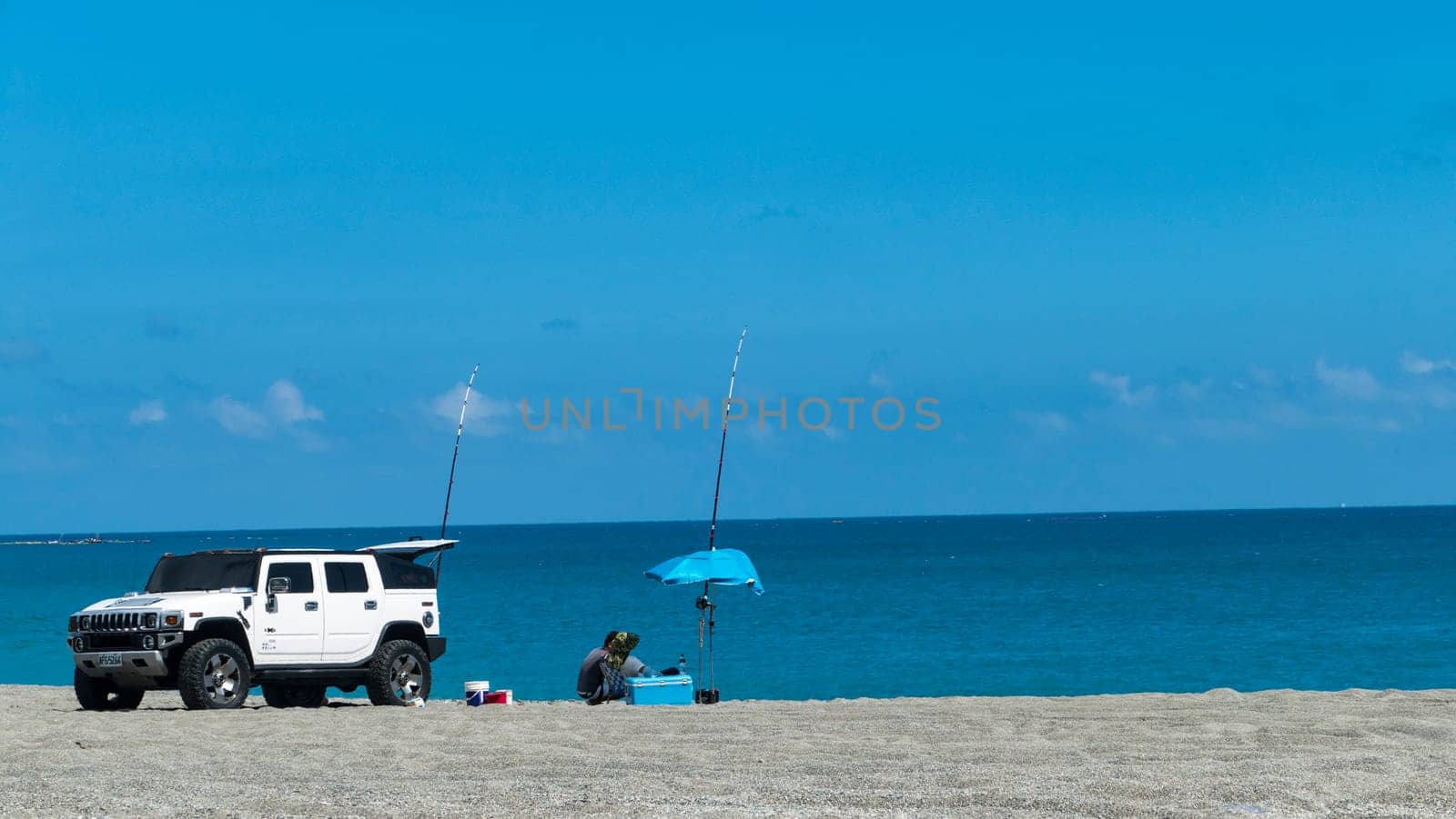 New Taipei City, Taiwan - 26 October : the man enjoin fishing on the beach with nice weather in New Taipei City, Taiwan