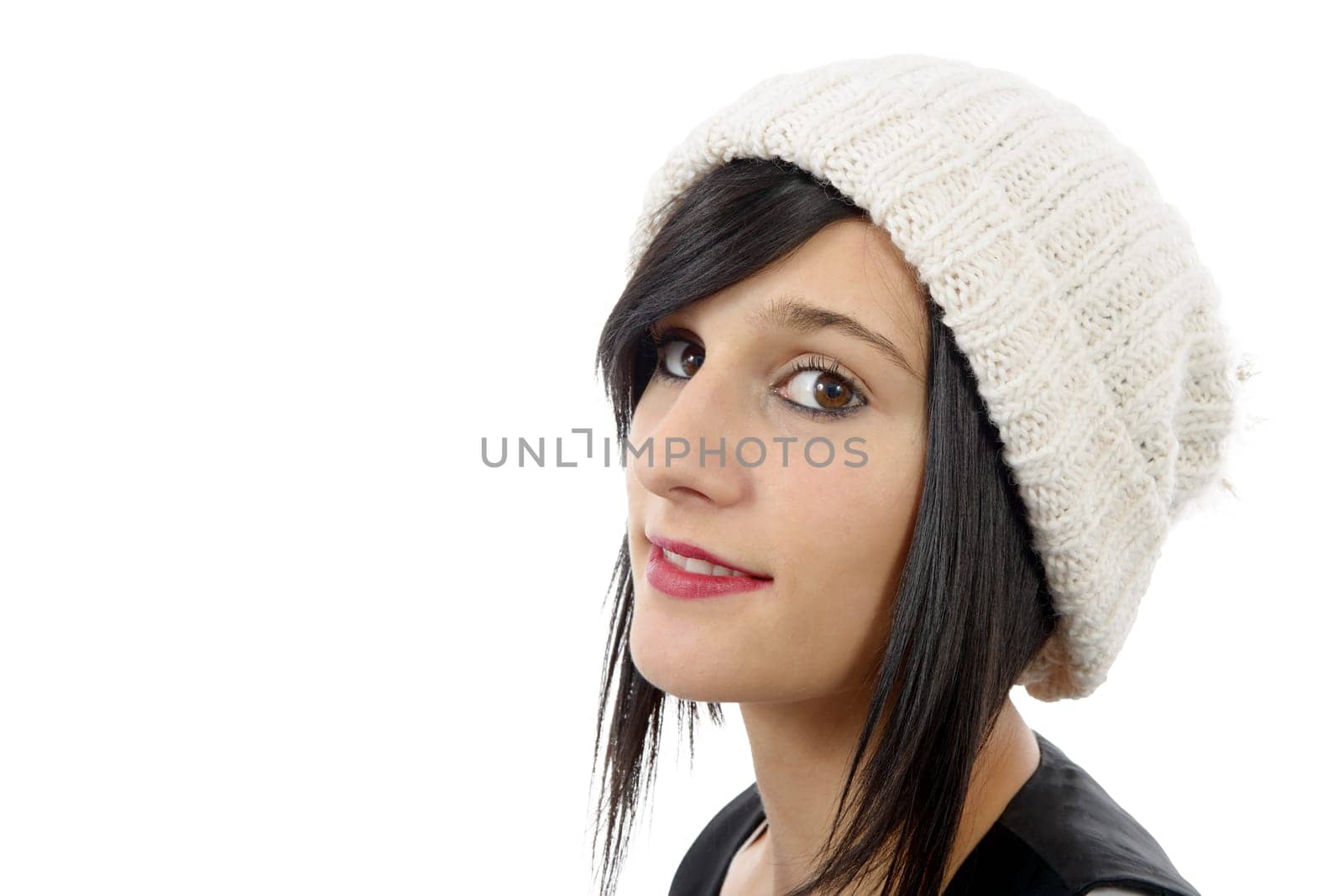 portrait of a pretty young brunette with winter hat isolated on white background