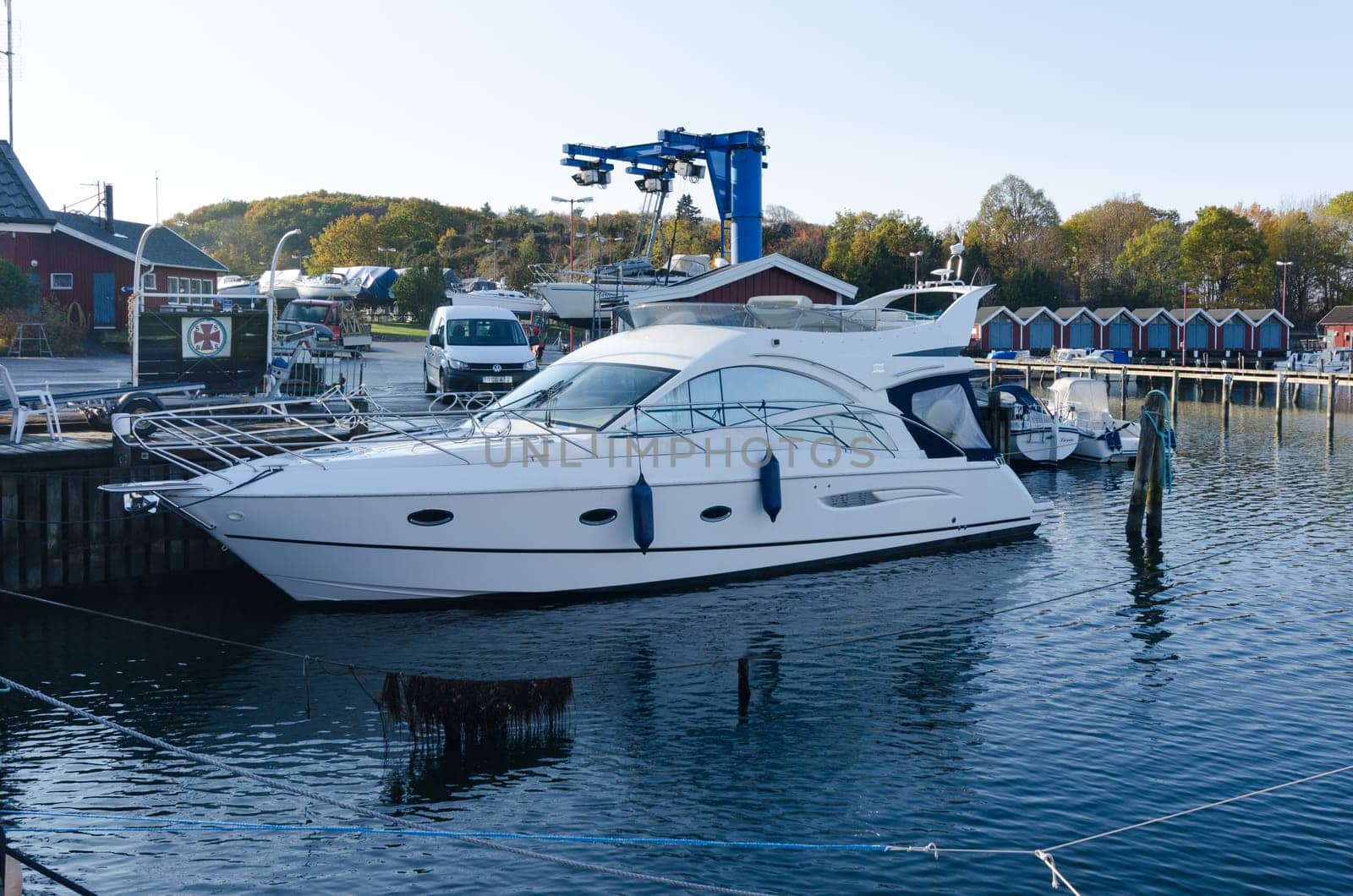 one big motorboat Yacht in the marina waiting to come up on land