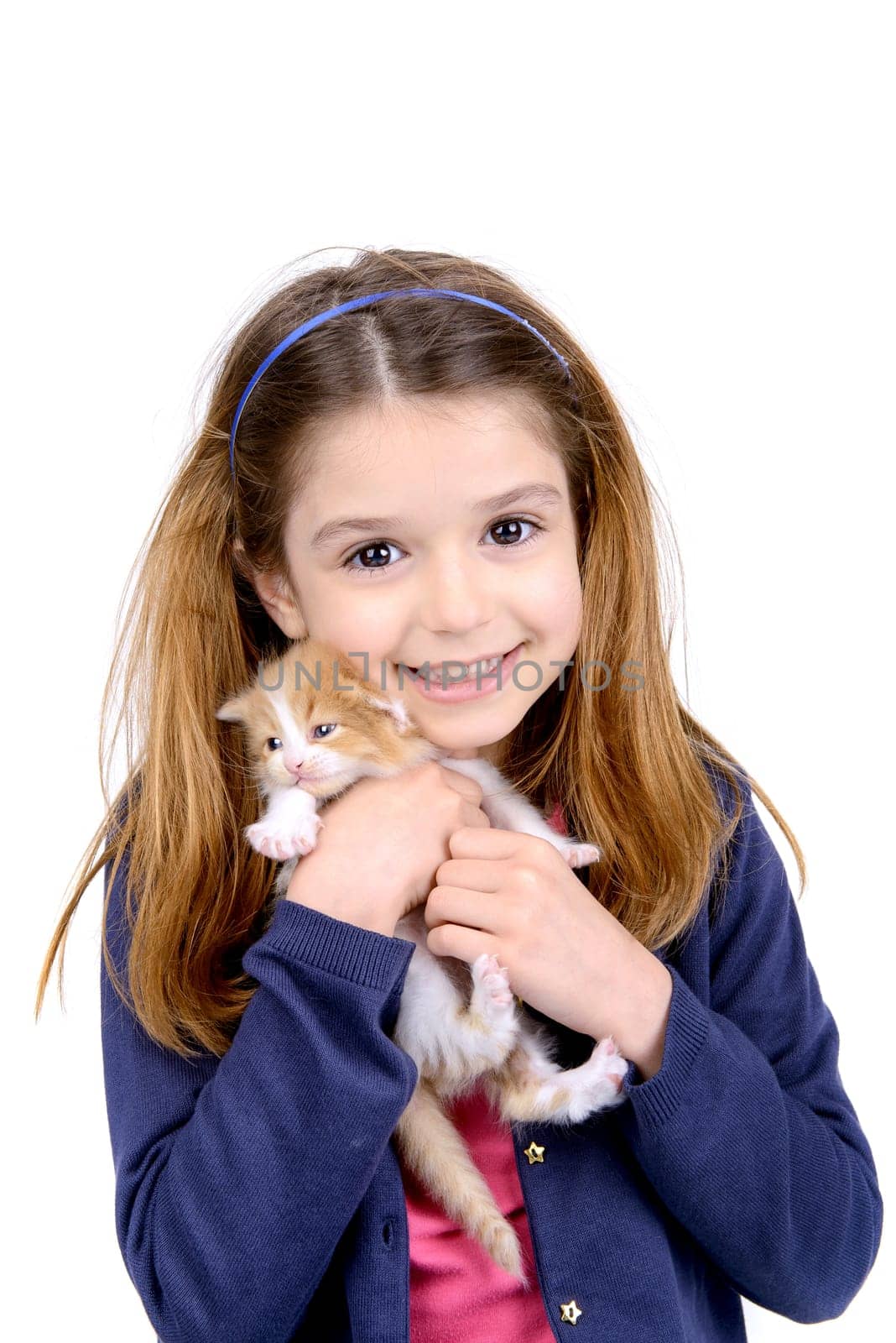 Beautiful young girl posing with a lovely young kitten