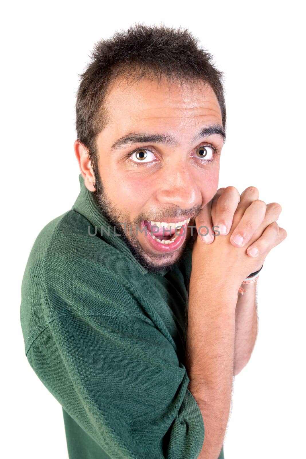 Young man making faces isolated in white
