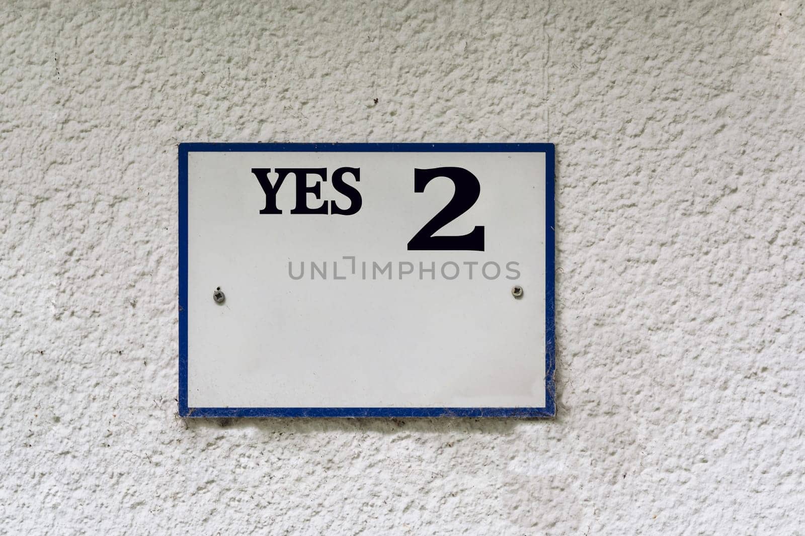 Sign or plaque with the inscription Yes 2..