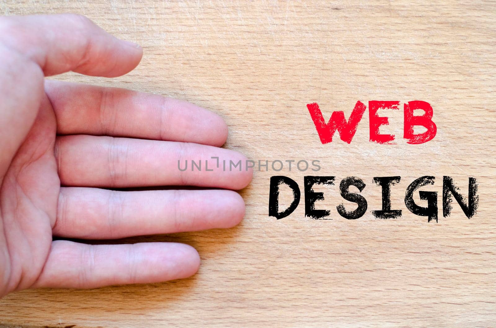 Human hand over wooden background and web design text concept