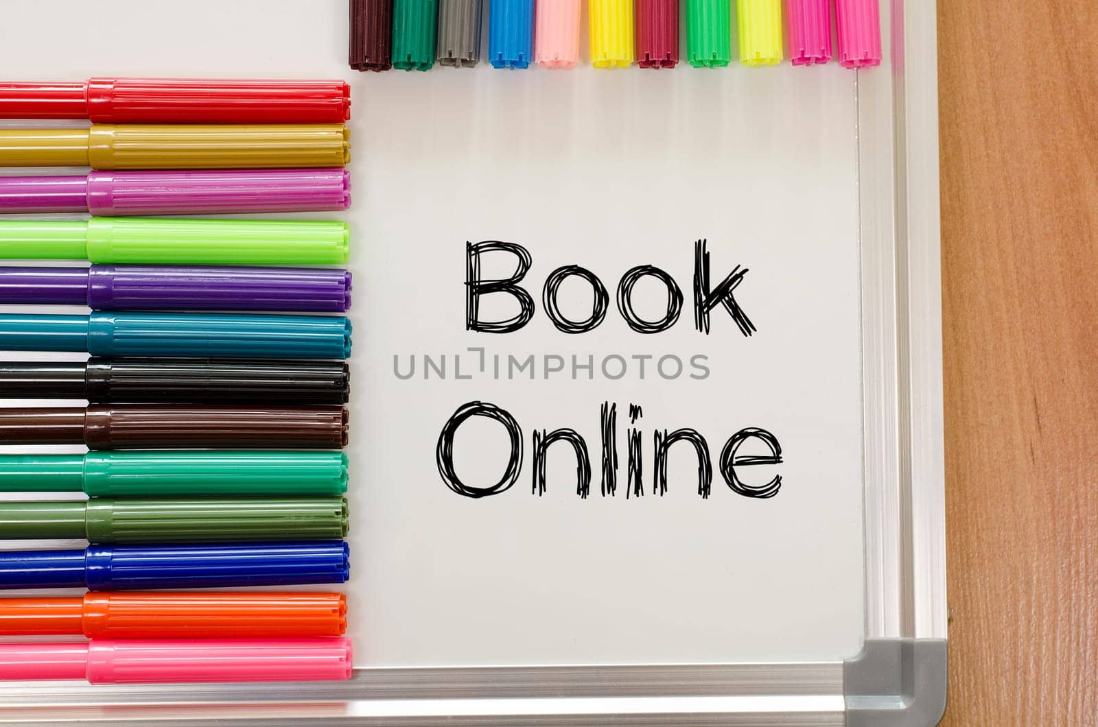 Book online text concept over whiteboard background
