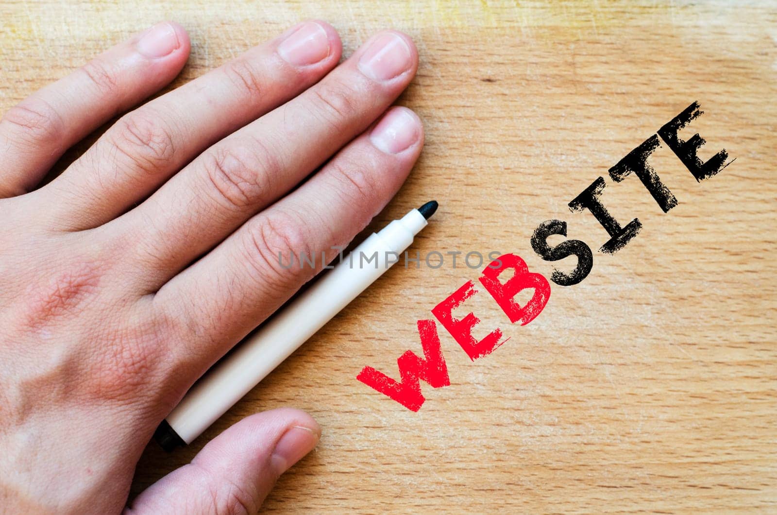 Human hand over wooden background and website text concept