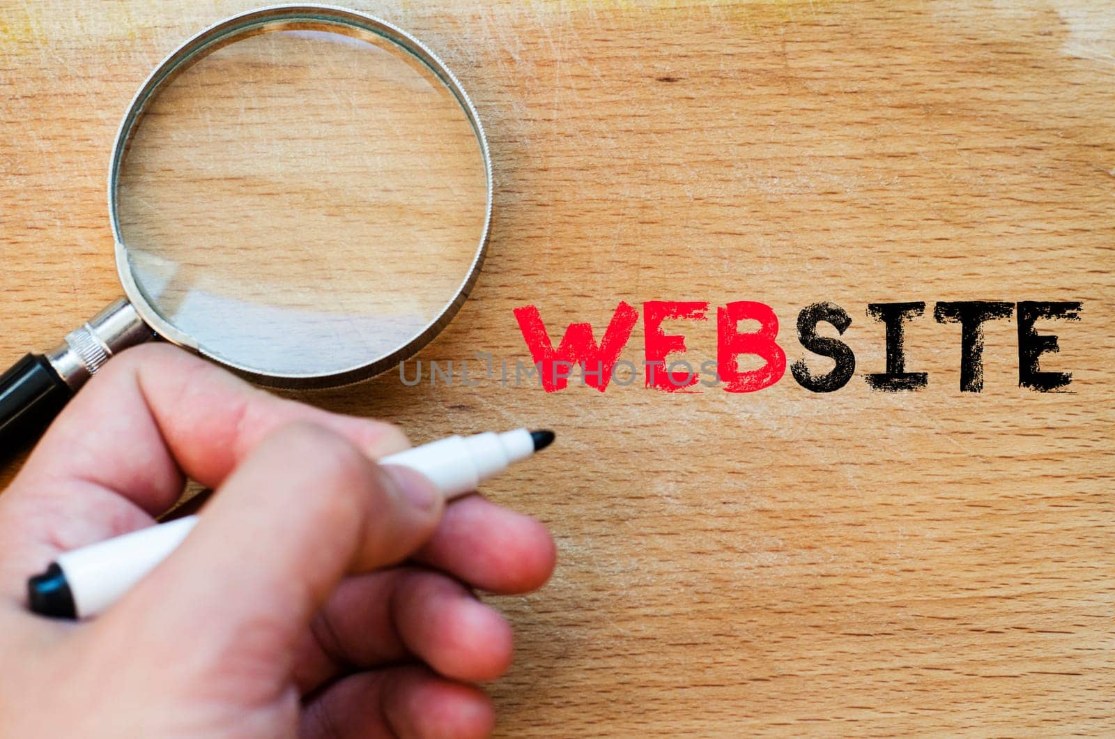 Human hand over wooden background and website text concept