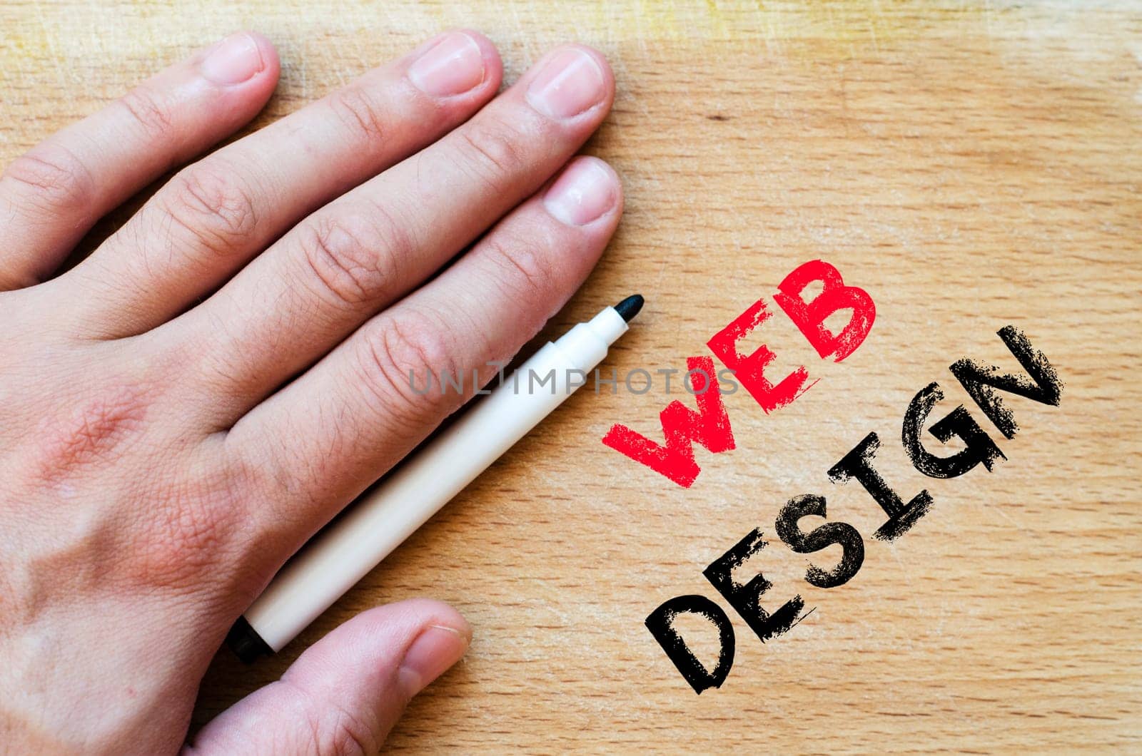 Human hand over wooden background and web design text concept