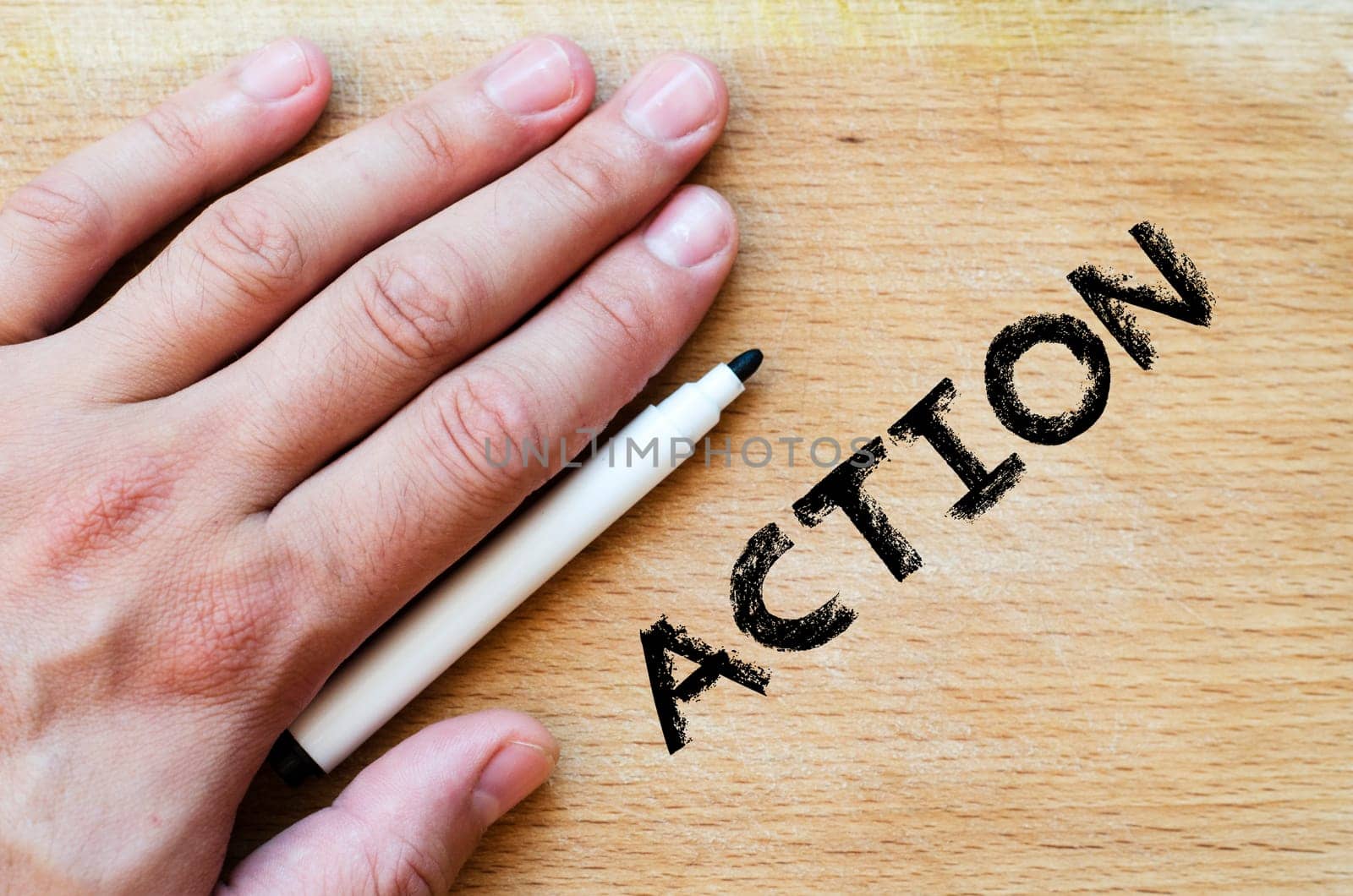 Human hand over wooden background and action text concept