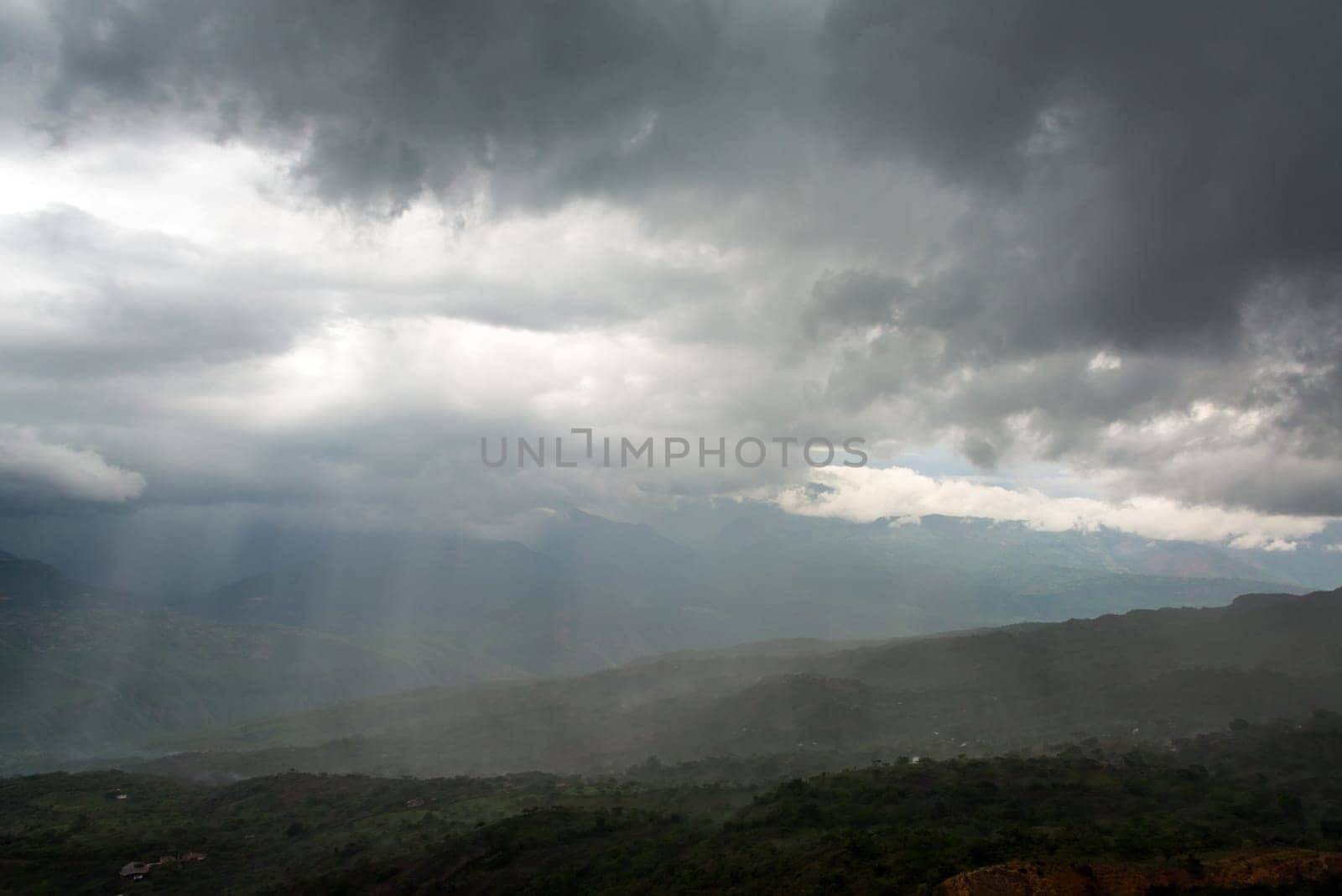 Strong storm over a valley as seen from the town of Barichara, Colombia