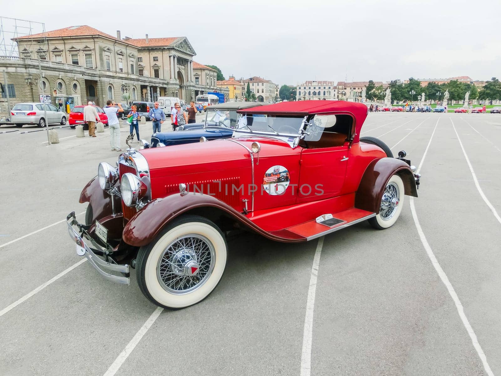 Padua, Italy - September 19, 2014: Benefit Antique Classic Car Show: People visiting and taking pictures of cars at Benefit Antique Classic Car Show at Padua at September 19, 2014. Cars and enthusiasts from all over Italy.