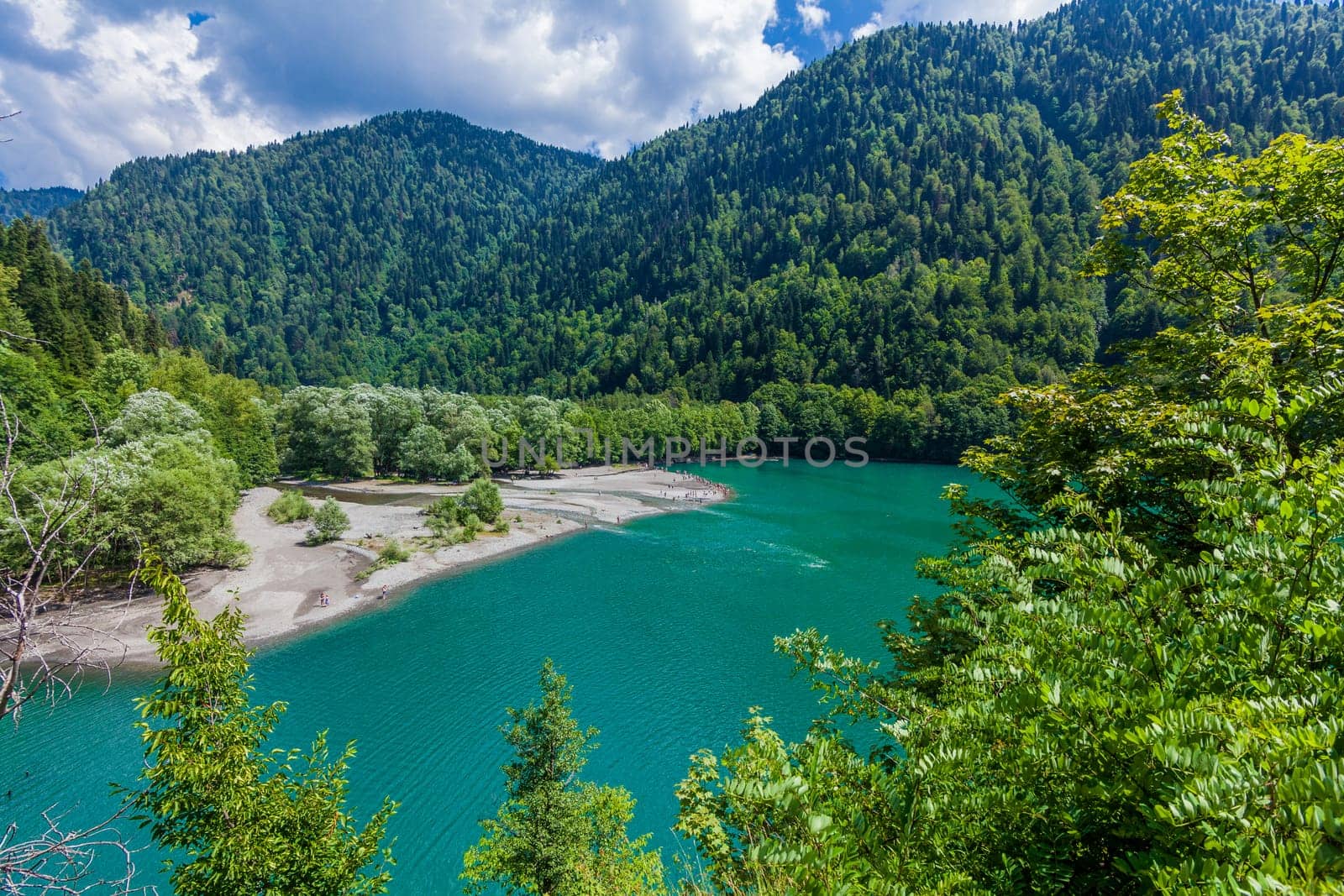 Beautiful landscape with lake, forest and mountains
