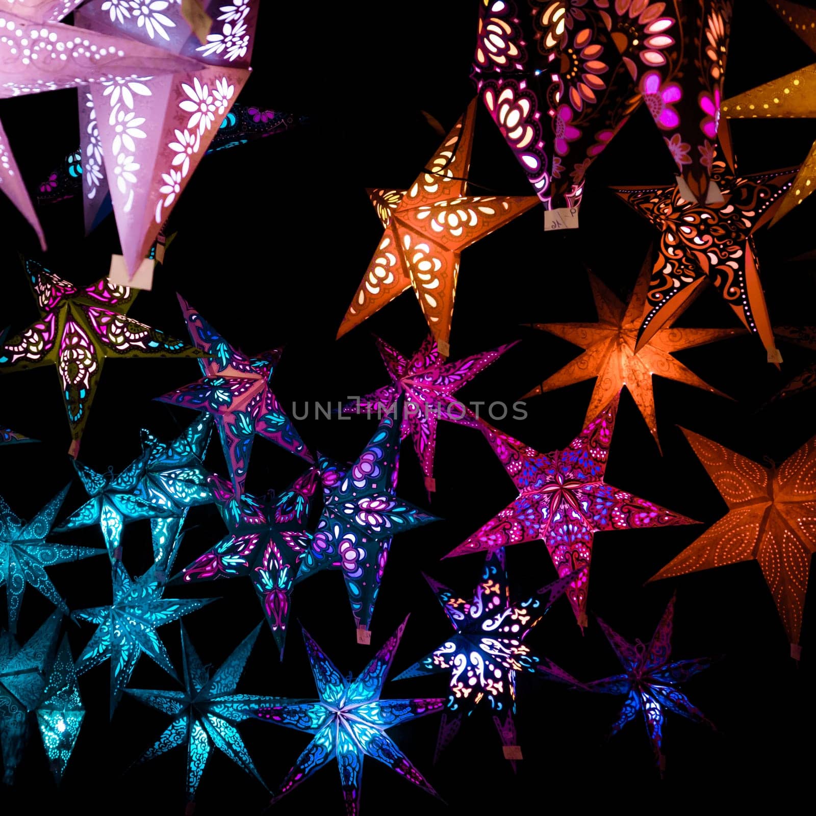 Beautiful christmas market stalls decorations. Colorful Christmas stars at a Christmas Market