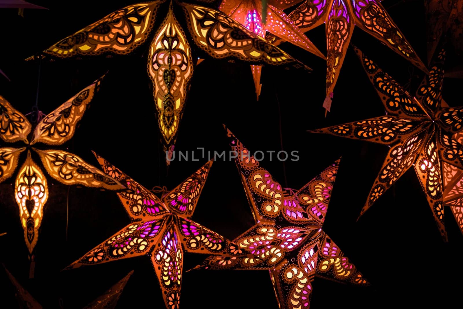 Beautiful christmas market stalls decorations. Colorful Christmas stars at a Christmas Market
