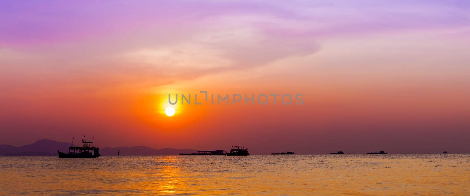 Beautiful landscape. sunset on the beach with fishing boat