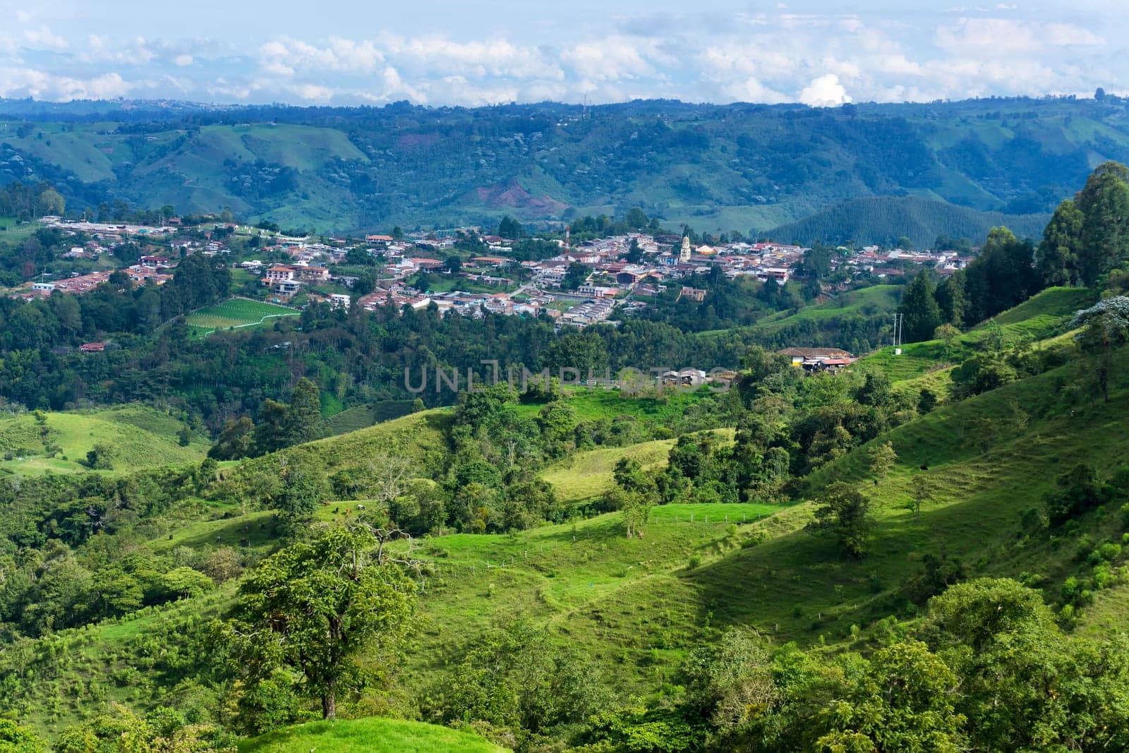 Beautiful lush green landscape with the town of Salento, Colombia visible in the background