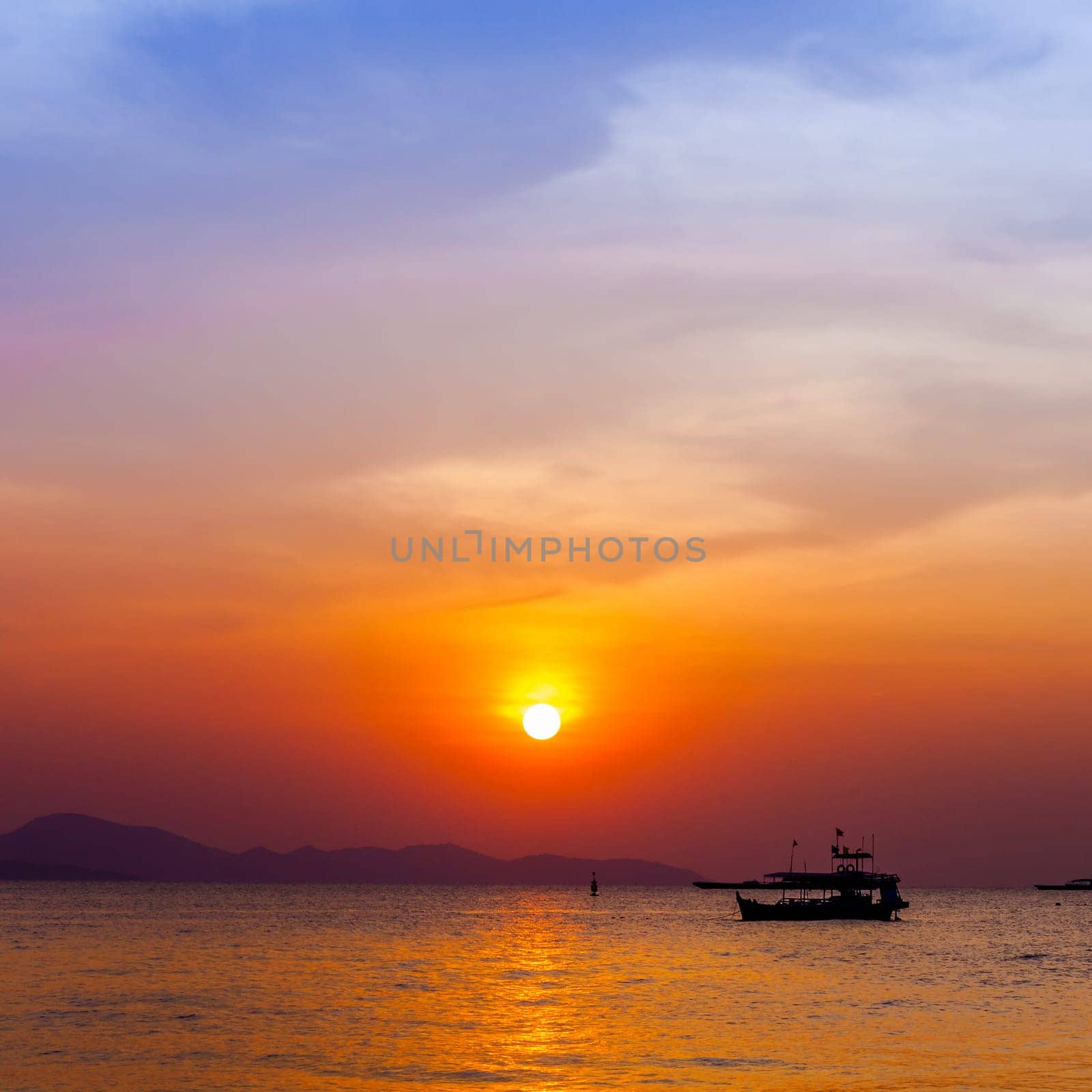 Beautiful landscape. sunset on the beach with fishing boat