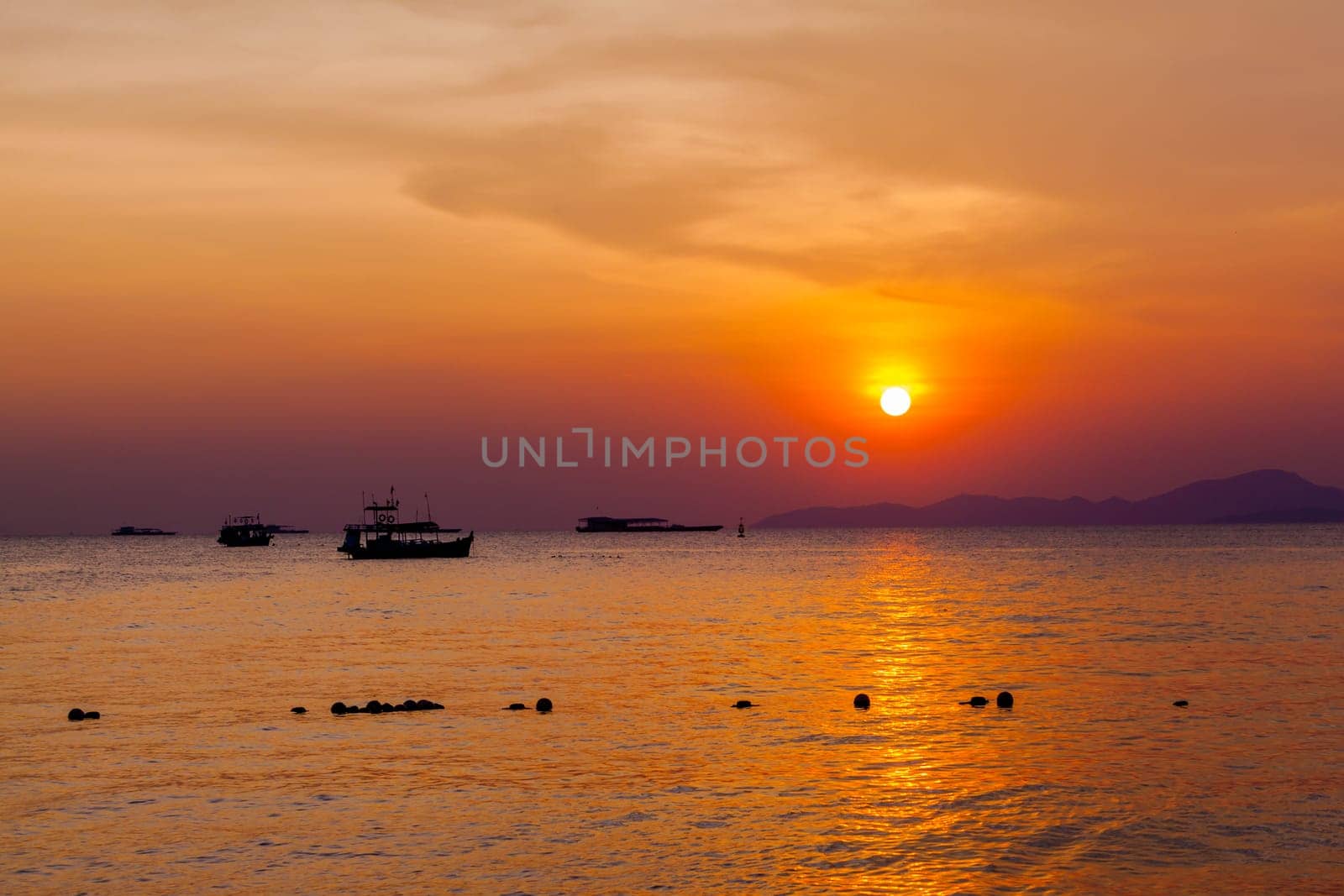 Beautiful landscape. sunset on the beach with fishing boat