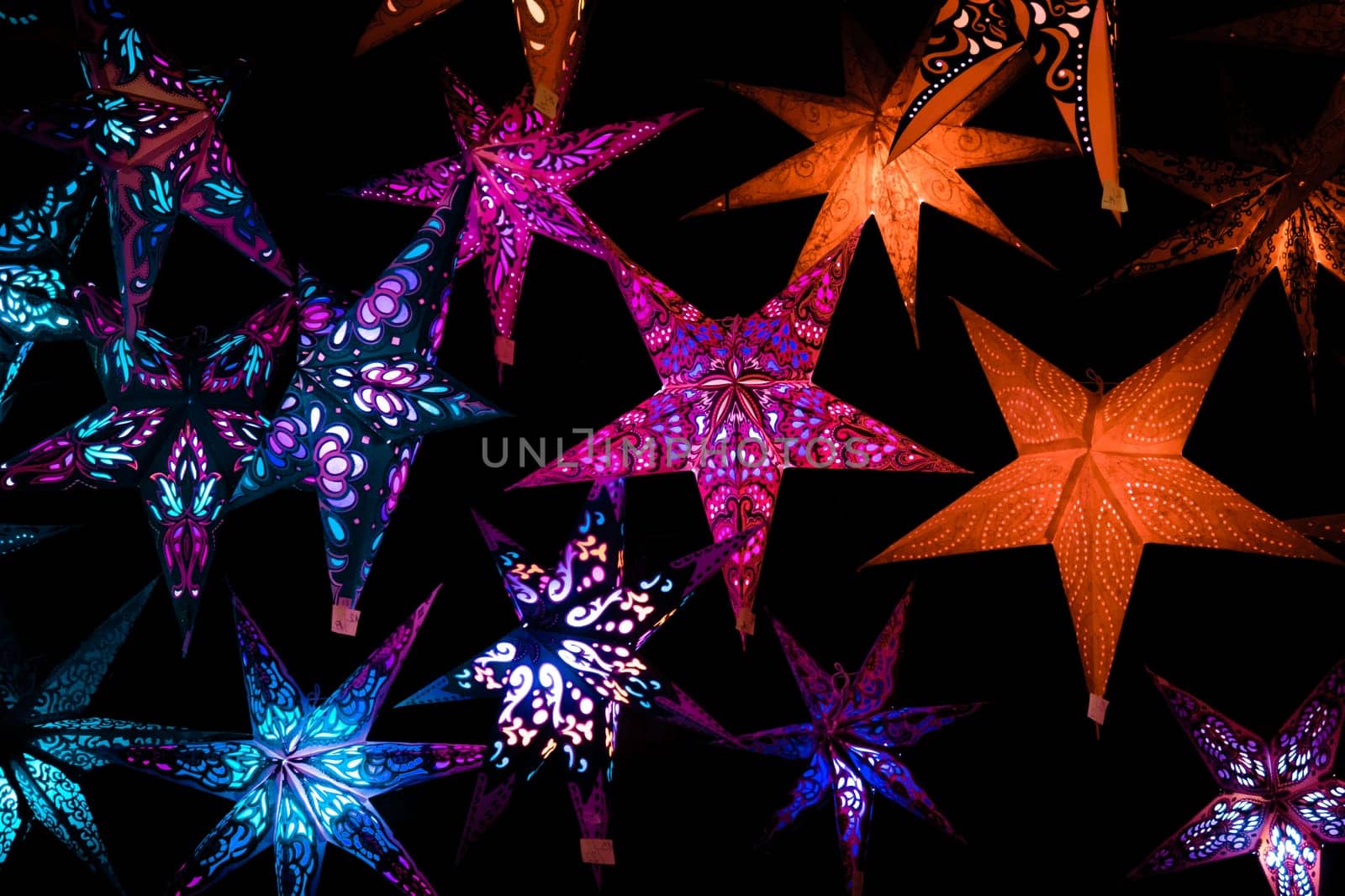 Beautiful christmas market stalls decorations. Colorful Christmas stars at a Christmas Market