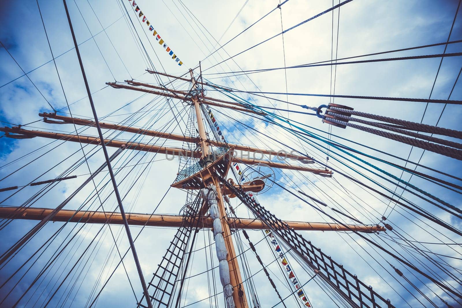 Detail of a sailboat rigging.  Mast on traditional sailboats. Mast of large wooden ship.