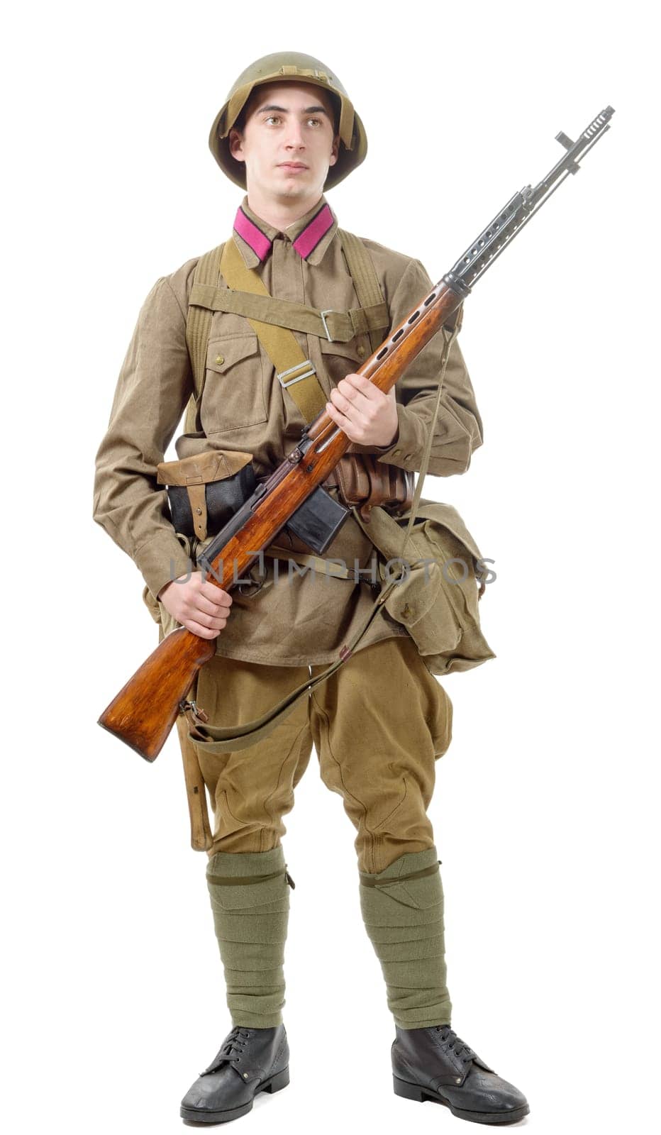 young Soviet soldier with rifle isolated on the white background