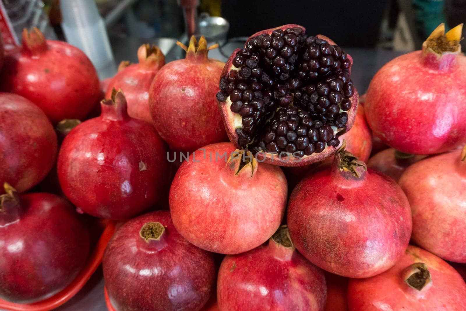 Pomegranates at the Market. Group of pomegranates. Pomegranate closeup, background