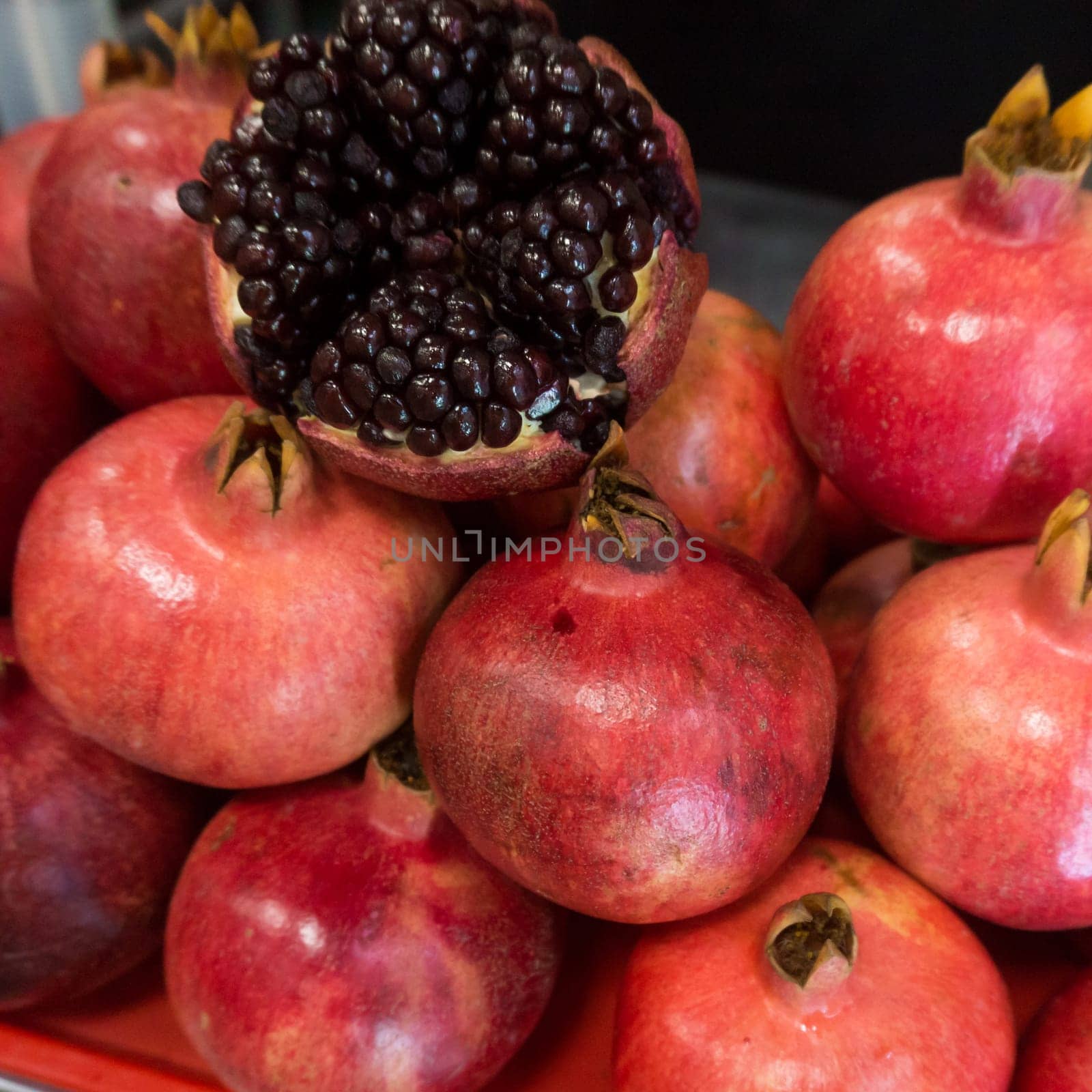 Pomegranates at the Market. Group of pomegranates. Pomegranate closeup, background