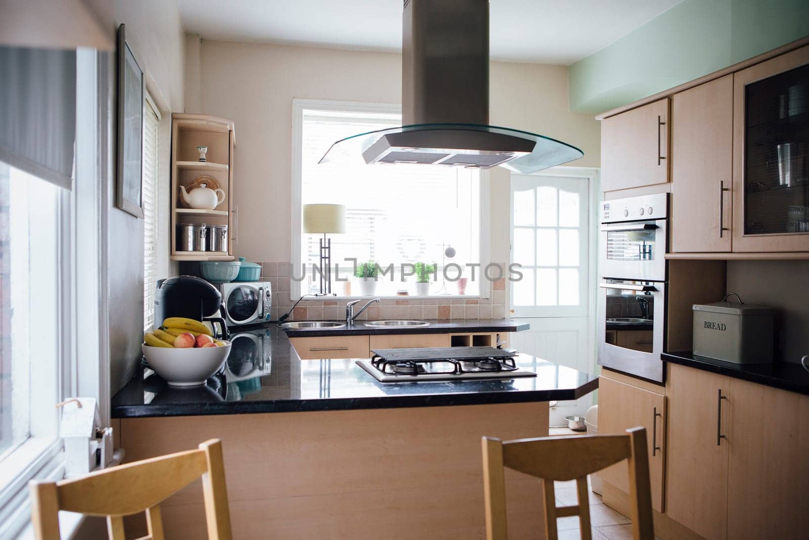 Horizontal image of an empty domestic kitchen.