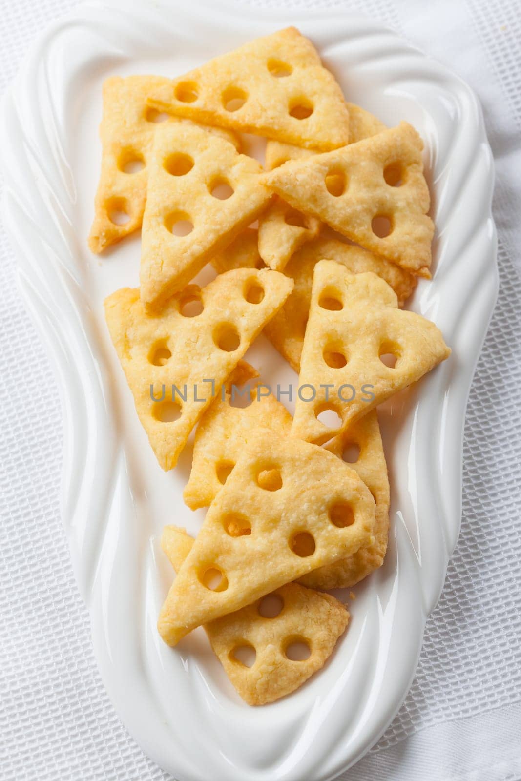 Homemade cheese crackers on white