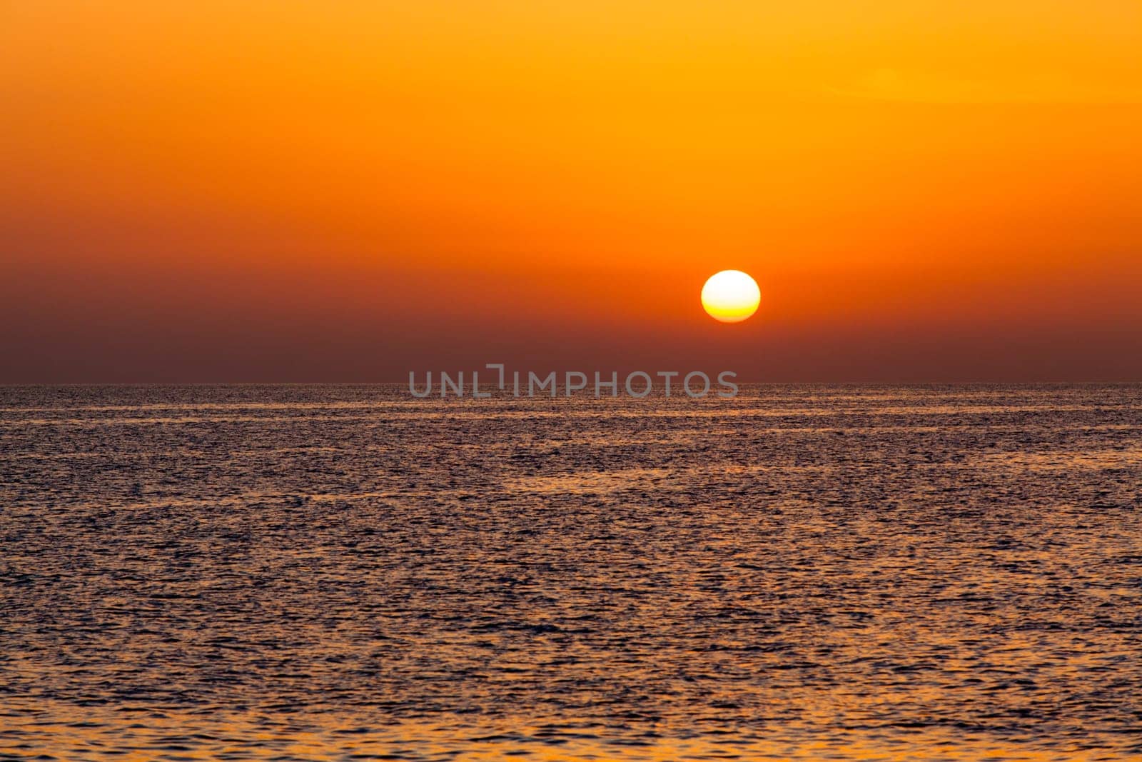 beautiful sunset above the sea.  Colorful sunset over water surface