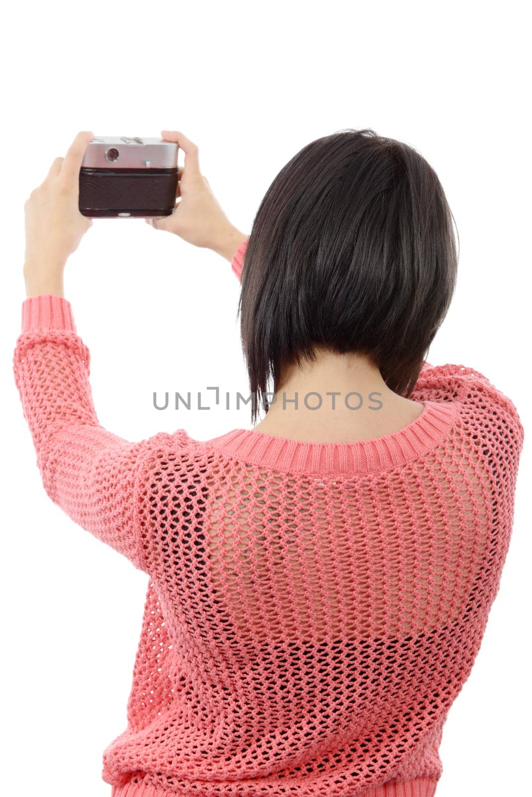 pretty young brunette woman with an antique camera