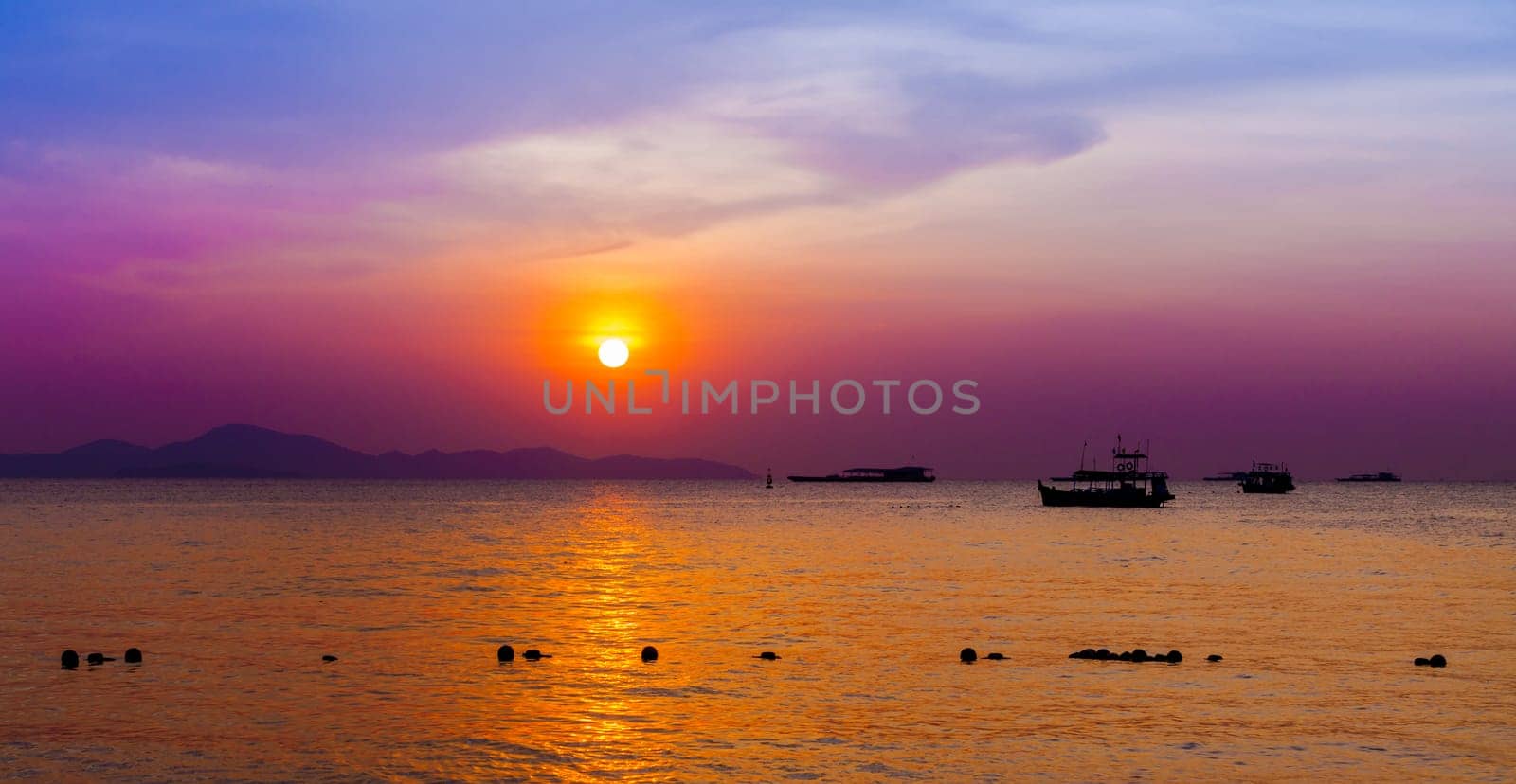 Beautiful landscape. sunset on the beach with fishing boat