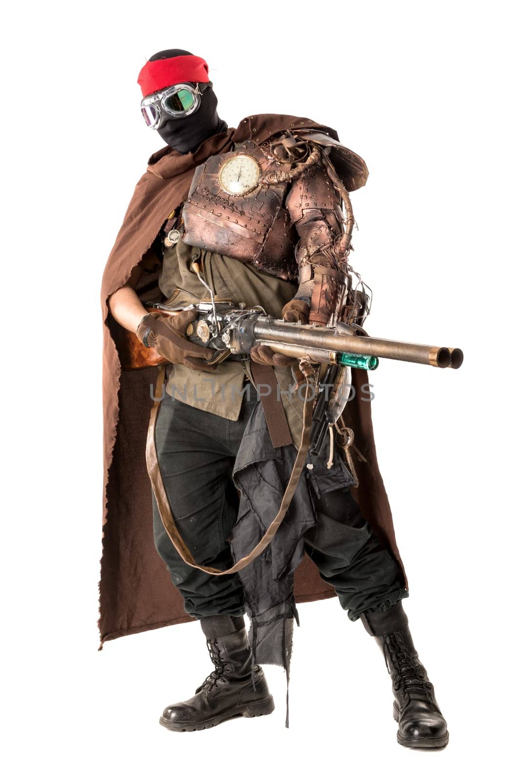 Futuristic soldier posing with gun and armor isolated in white