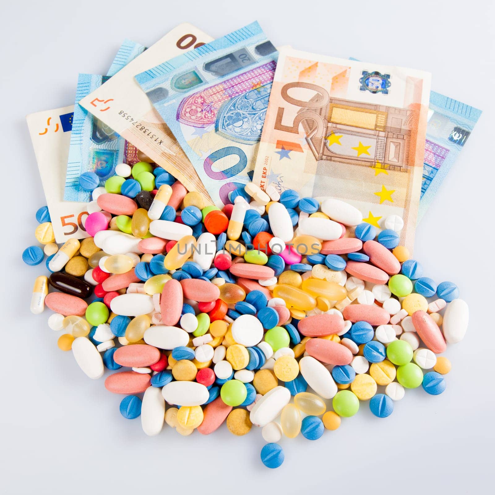 pills on money.  medicine tablets on money