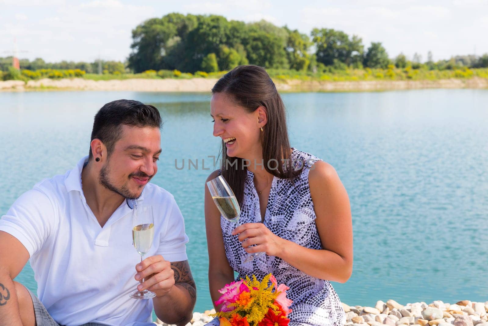 Happy young couple with champagne glasses,engagement,Bavaria,Germany