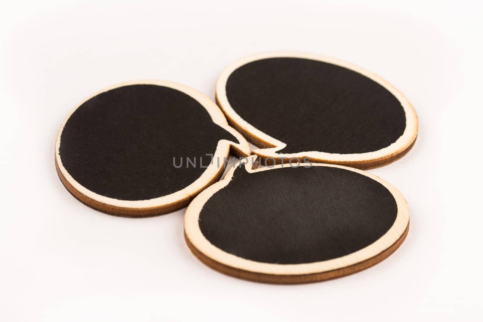 wooden speech bubbles next to each other isolated on white background metaphor, concept for communication
