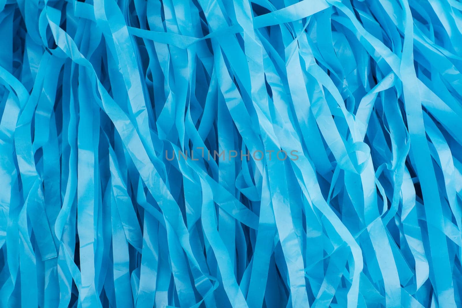 horizontal pattern close up with many blue plastic strips