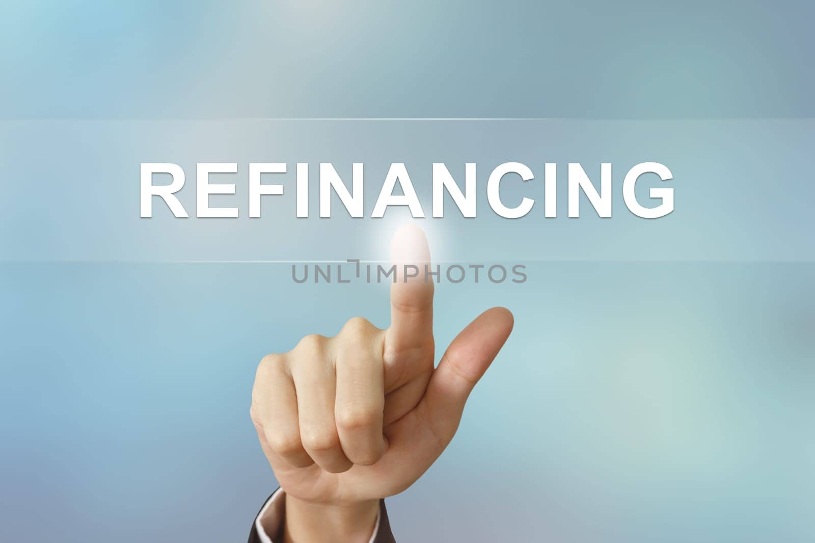 business hand pushing refinancing button on blurred background