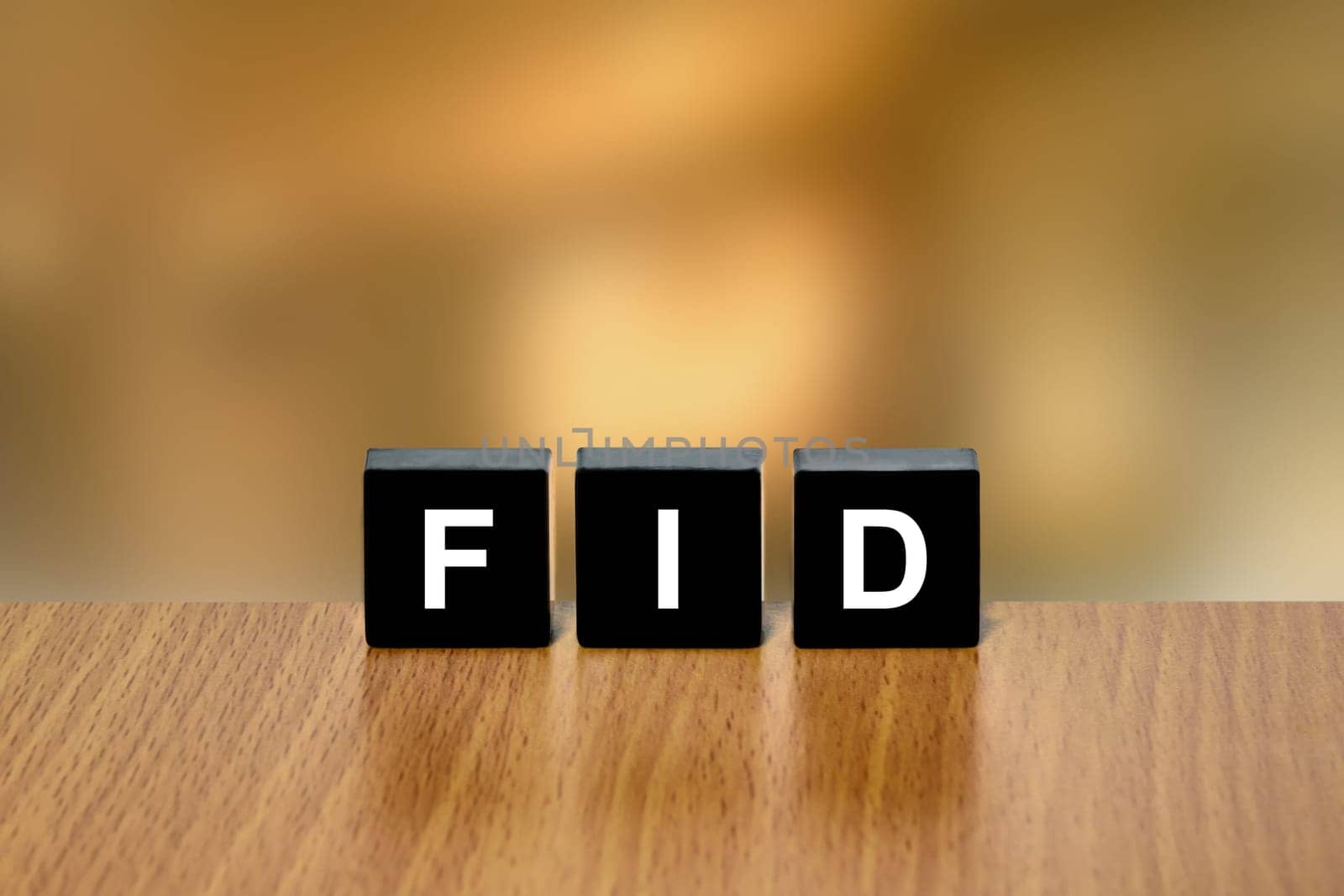 FID or final investment decision on black block with blurred background