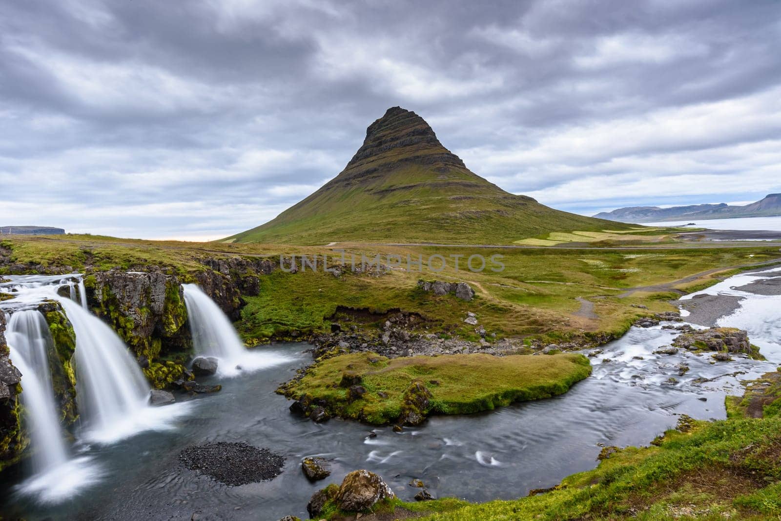 Beautiful Kirkjufell mountain with cloudy, Snaefellsnes peninsula, Iceland, selective focus