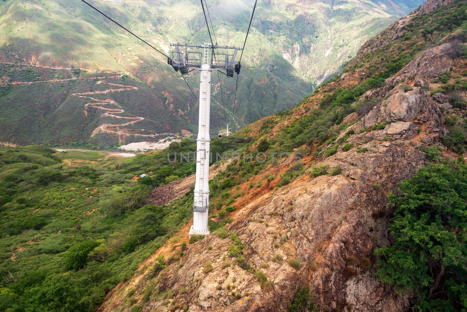 Aerial tram passing through the rugged landscape of Chicamocha Canyon near Bucaramanga, Colombia