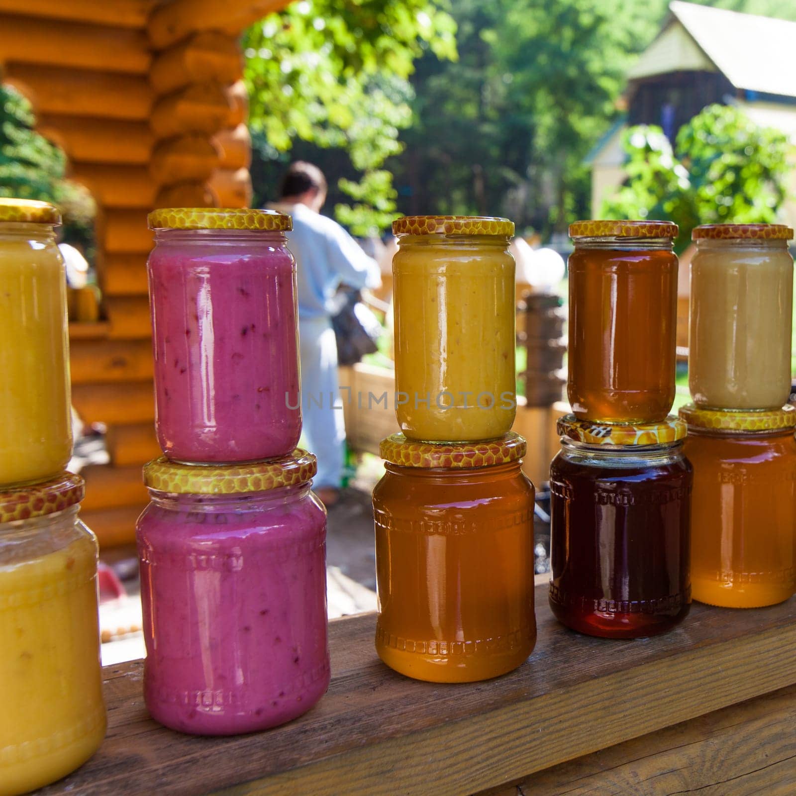 jars with honey on market.  Homemade honey. various jars of honey