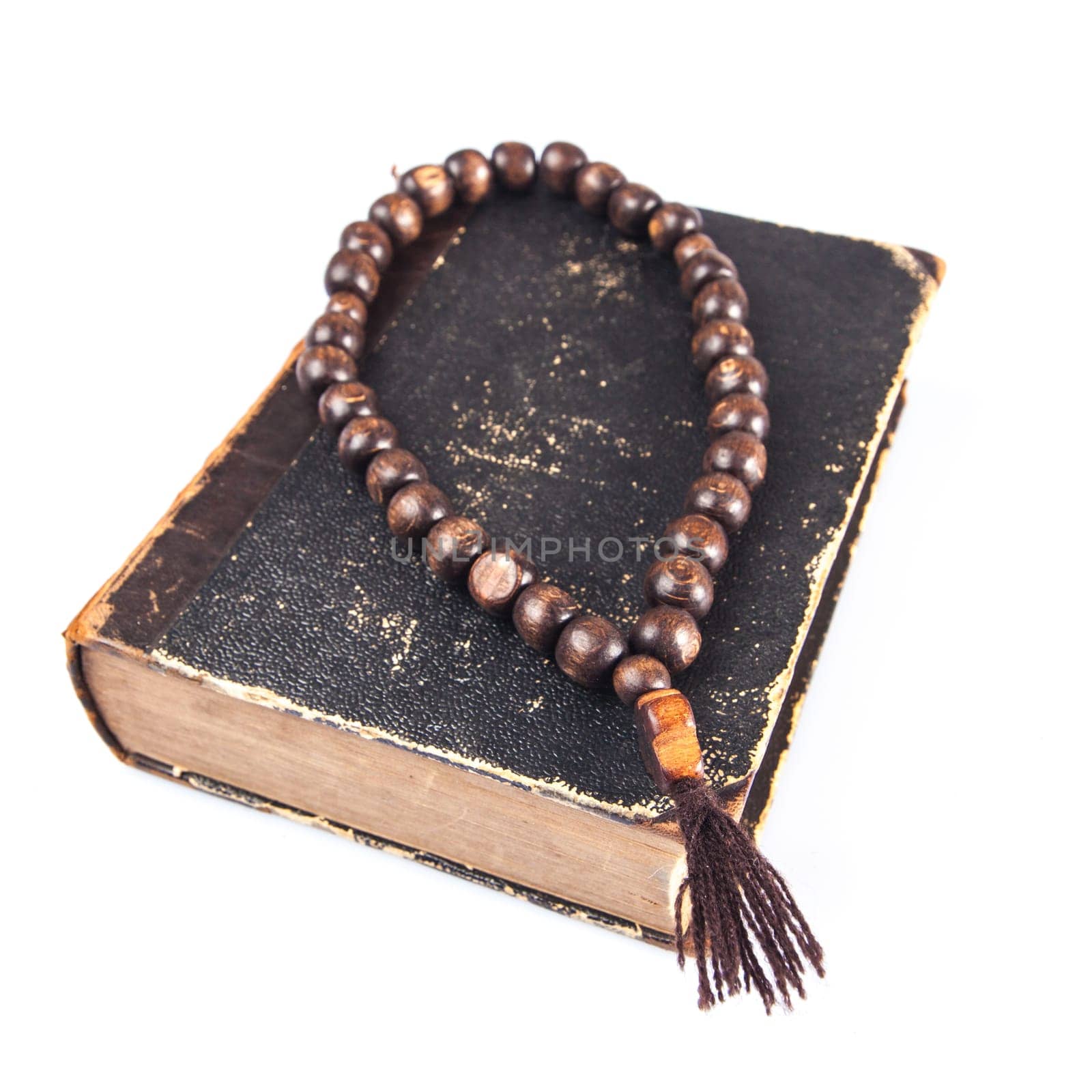 rosary beads on old books