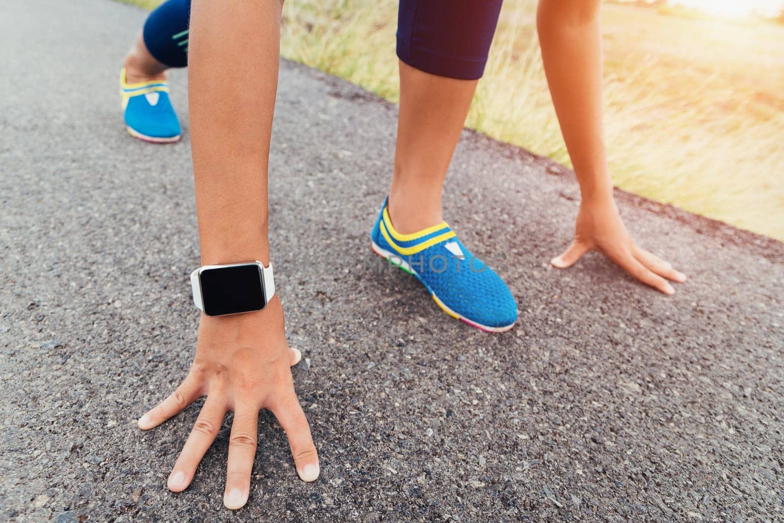 runner gesture ready start to run on road