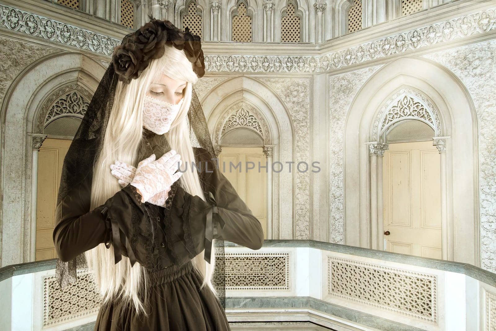 Girl in a widow black dress with white eyes looking like a doll