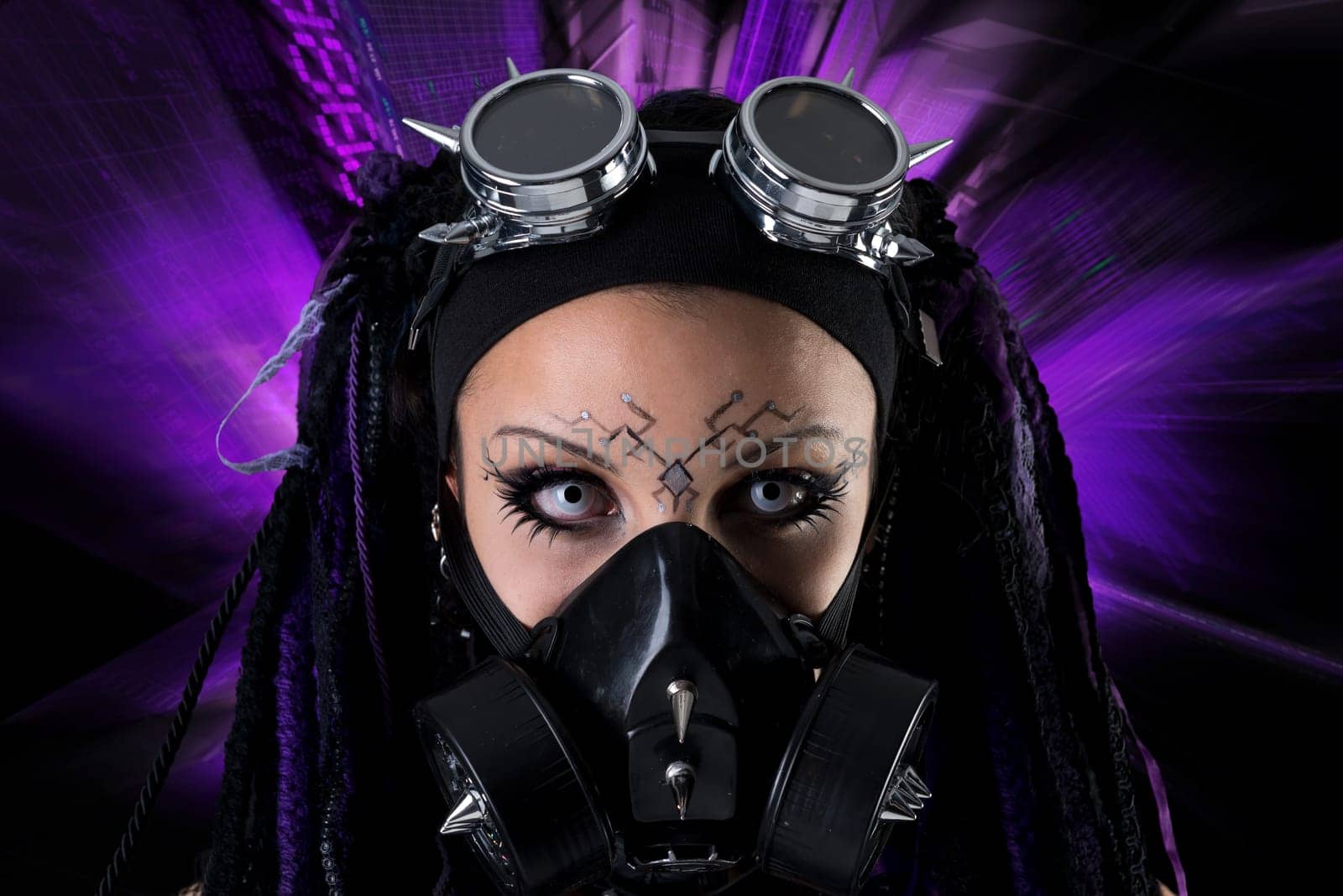 Cyber Gothic girl with rays of light in a dark background