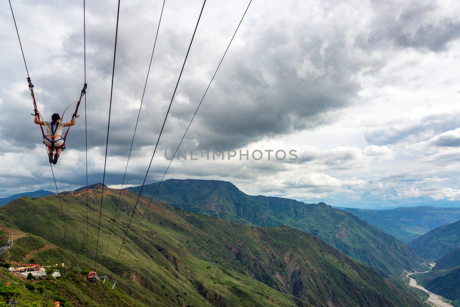 CHICAMOCHA CANYON, COLOMBIA - MAY 8: Woman zip lines through Chicamocha Canyon, Colombia on May 8, 2016