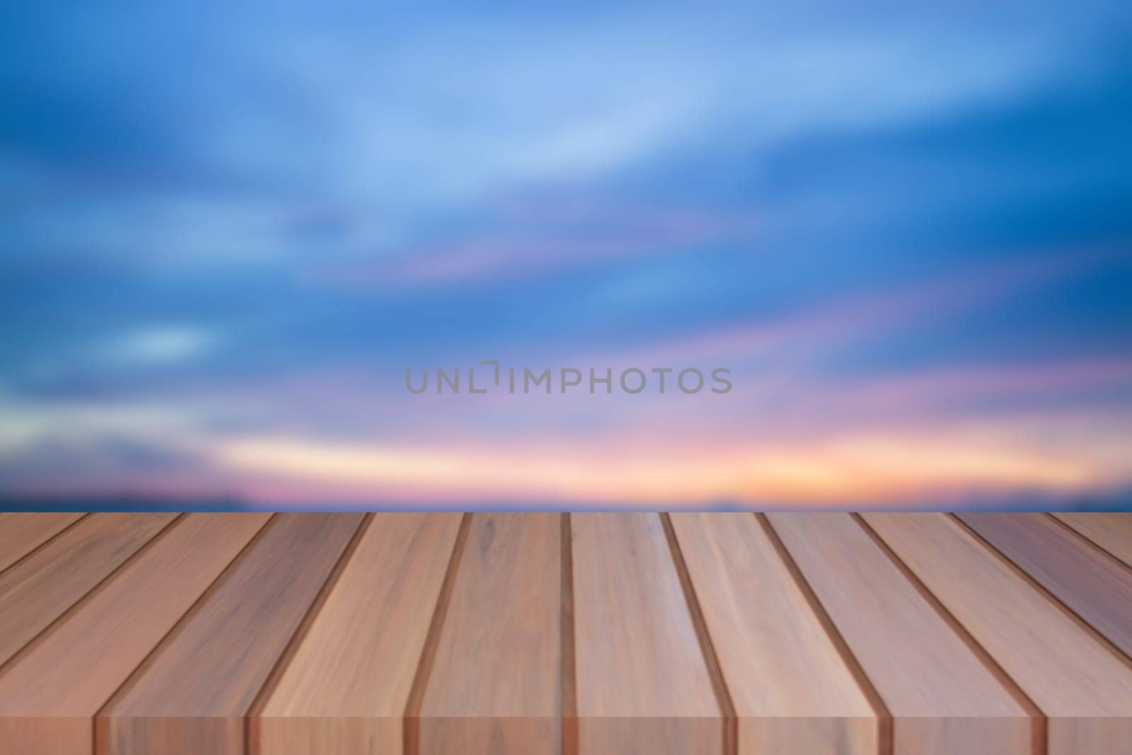 Empty top of wooden table with sunset background. For product display